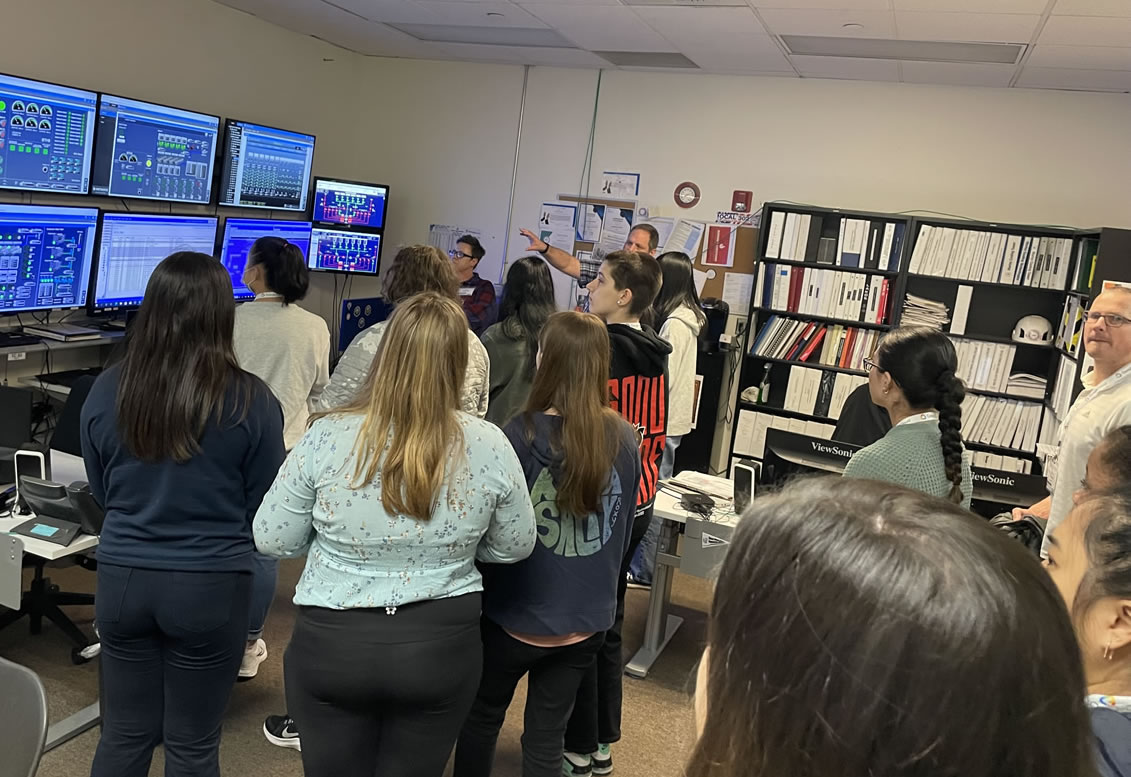 Group looking at monitors